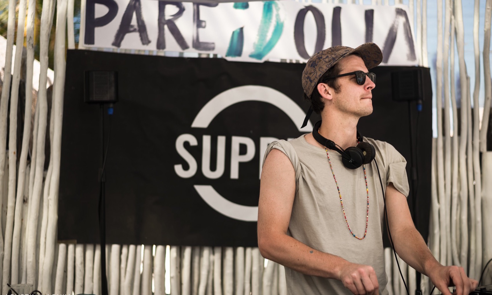 Andrew Smith performing as Misawa at Pareidolia in Tulum, presented by Ibiza Sonica Radio, in front of a Supply New York banner.
